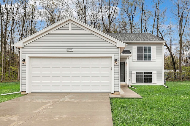 view of front of house with a front lawn and a garage