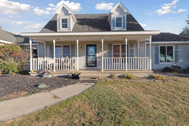 view of front of home with a front lawn and a porch