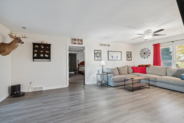 living room with ceiling fan and hardwood / wood-style floors