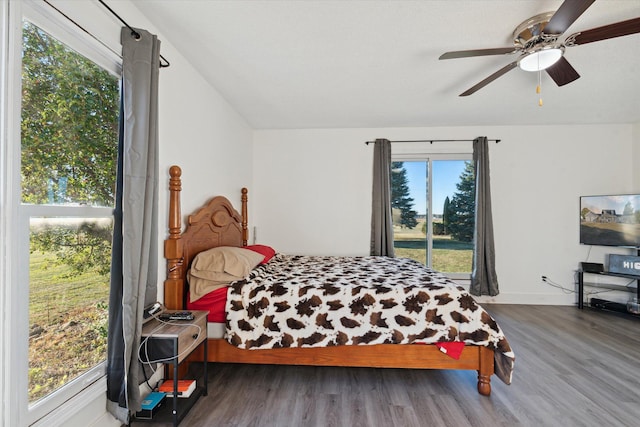 bedroom featuring ceiling fan and dark hardwood / wood-style floors