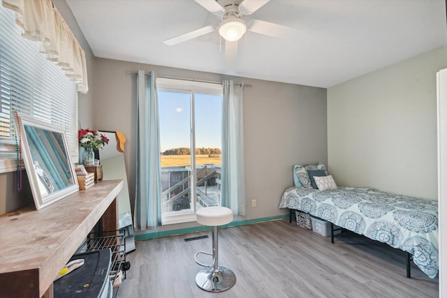 bedroom featuring light hardwood / wood-style flooring and ceiling fan