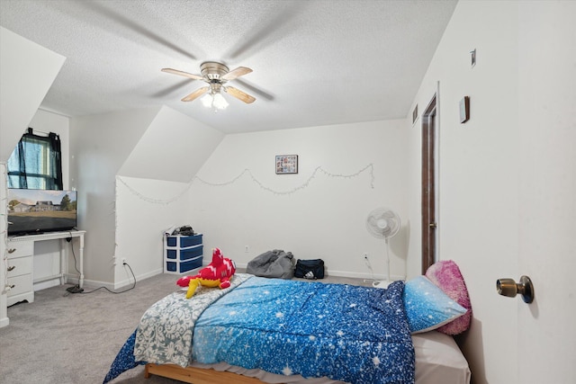 carpeted bedroom featuring a textured ceiling and ceiling fan