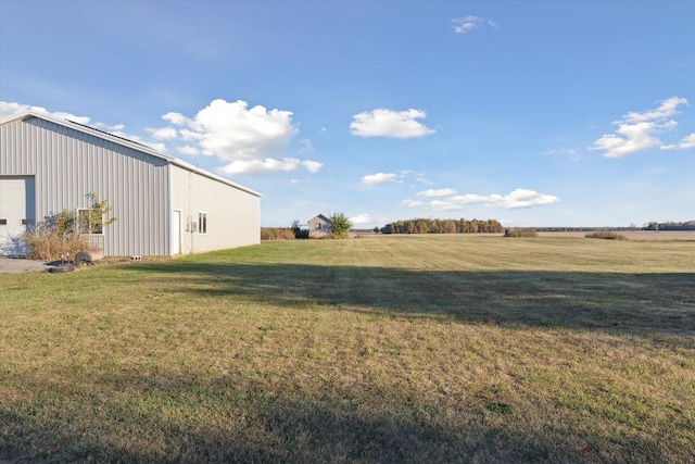 view of yard with a rural view