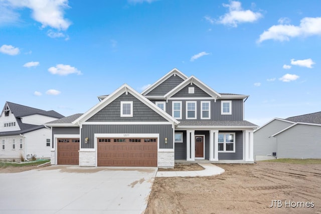 craftsman inspired home featuring a garage