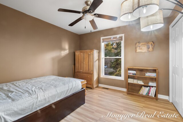 bedroom featuring light hardwood / wood-style floors and ceiling fan