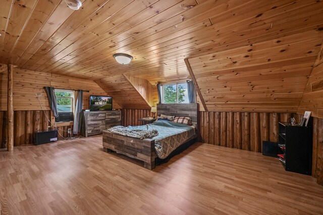 unfurnished bedroom with multiple windows, hardwood / wood-style flooring, lofted ceiling, and wood ceiling