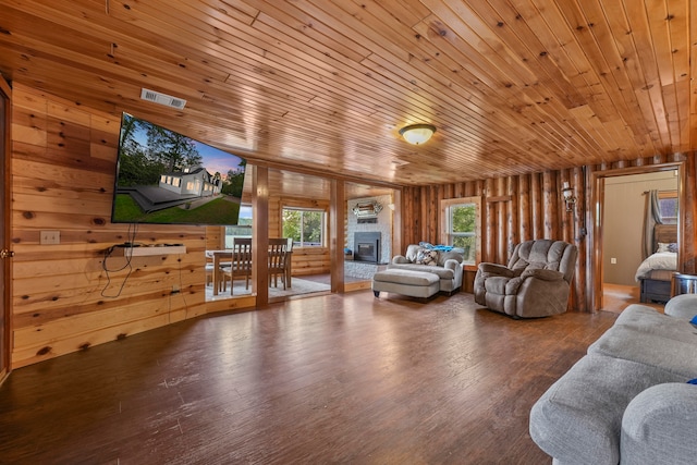 living room with wood ceiling, hardwood / wood-style flooring, and wood walls