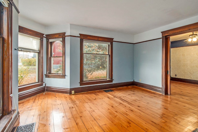 unfurnished room with light hardwood / wood-style floors and ceiling fan