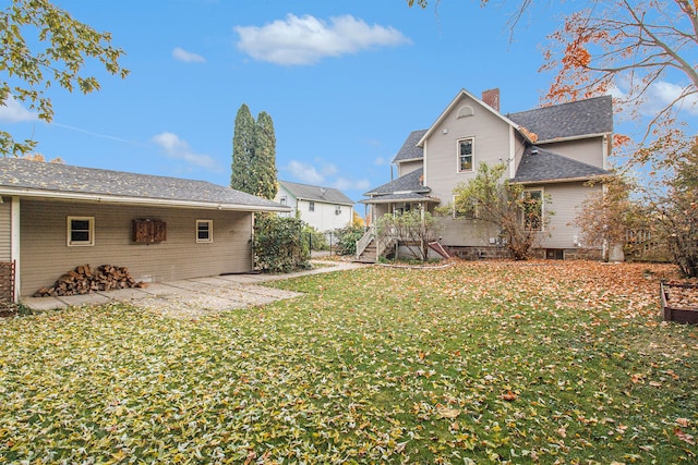 exterior space featuring a yard and a patio area