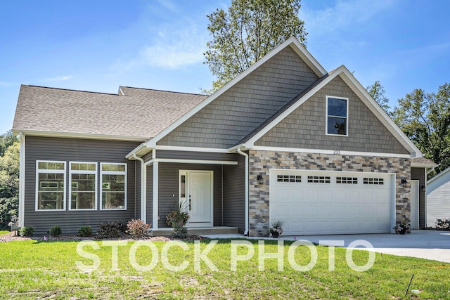 craftsman-style house featuring a front yard and a garage