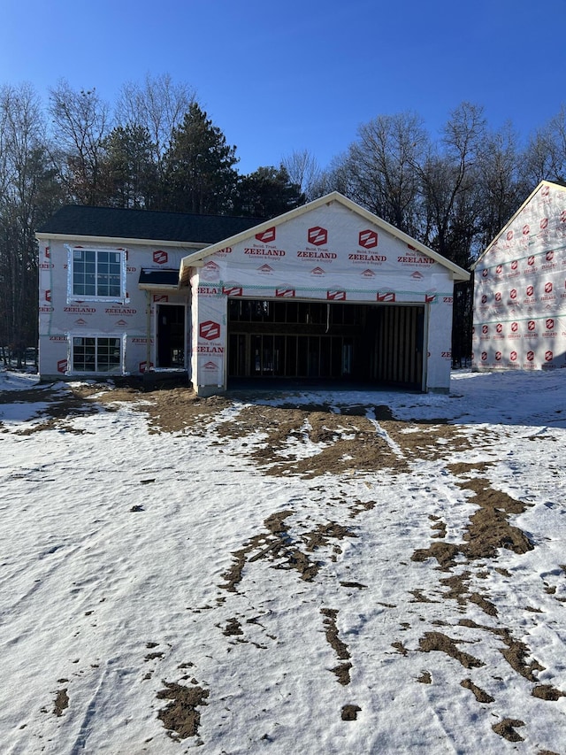 unfinished property featuring a garage