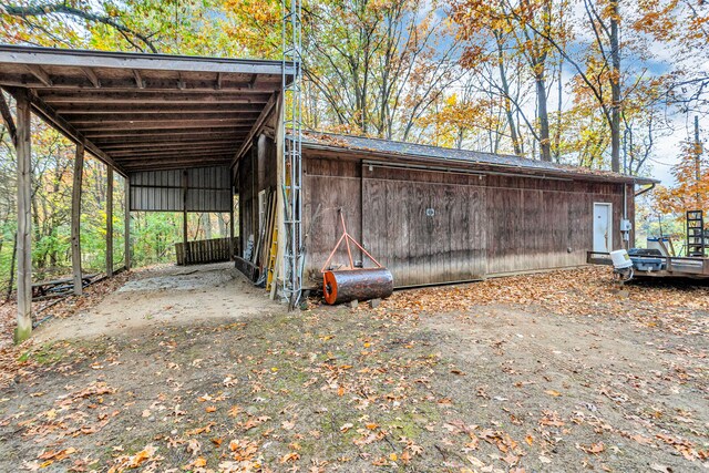 view of outbuilding featuring a carport