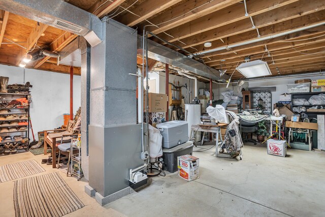 basement with heating unit and gas water heater