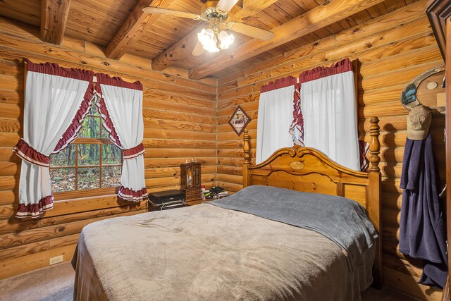 bedroom with wood ceiling, beam ceiling, and log walls