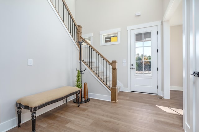 foyer entrance with light wood-type flooring