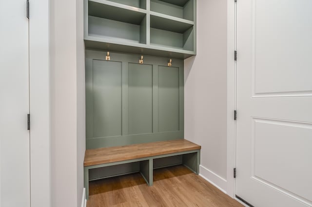 mudroom with light hardwood / wood-style flooring