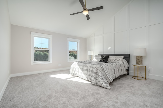 bedroom with ceiling fan, light carpet, and high vaulted ceiling