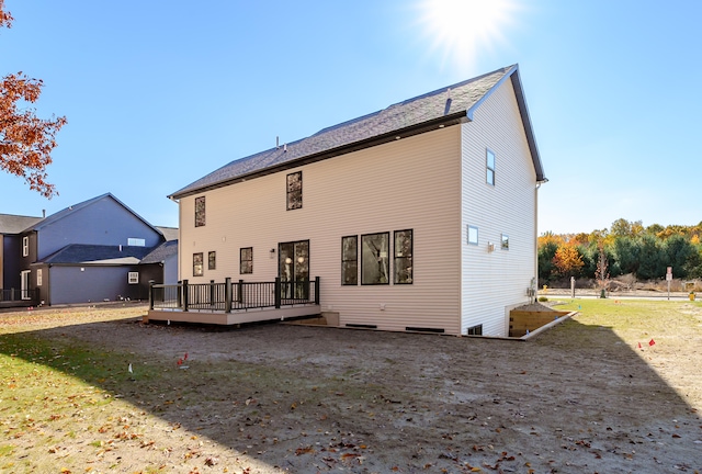 rear view of house featuring a deck