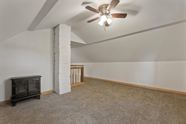 bonus room with lofted ceiling, carpet, and ceiling fan