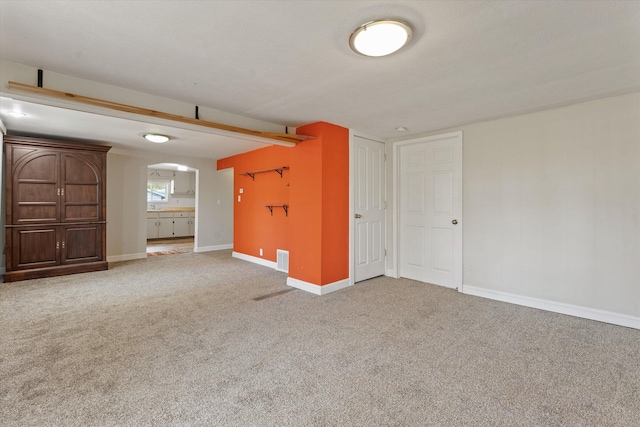 unfurnished room featuring carpet floors