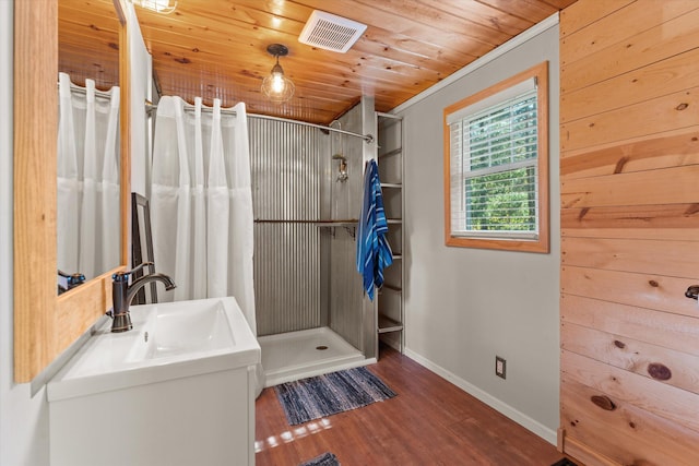 bathroom with wood ceiling, wood-type flooring, ornamental molding, vanity, and a shower with curtain