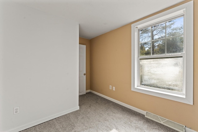 unfurnished room with carpet floors