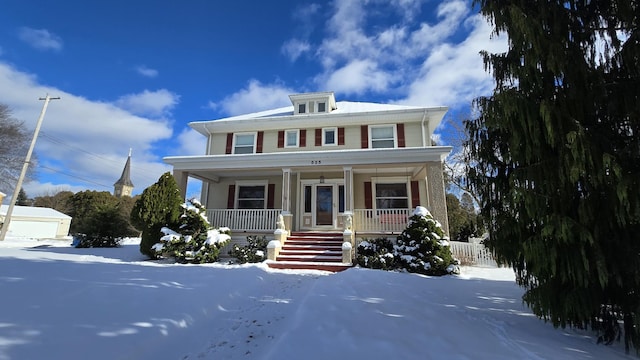 view of front facade with covered porch and a garage