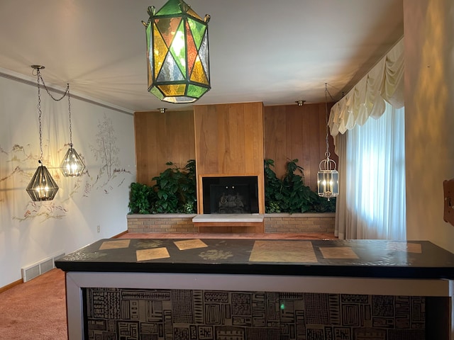 interior space featuring carpet floors and wooden walls