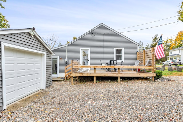 back of house featuring a deck