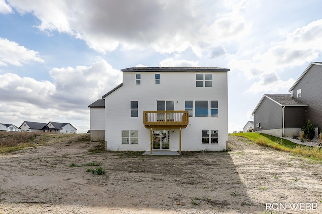 rear view of property with a balcony and a patio area