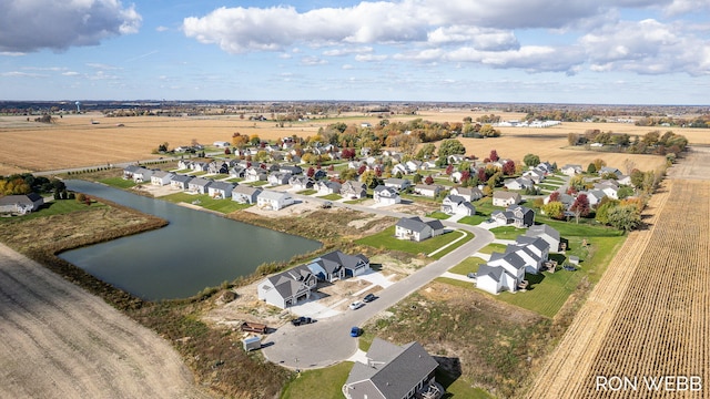 aerial view with a rural view and a water view