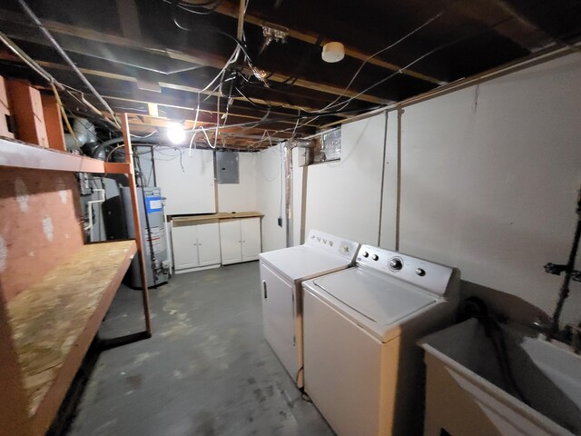 laundry area featuring electric panel, sink, separate washer and dryer, and water heater