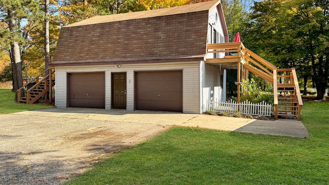 garage with a yard