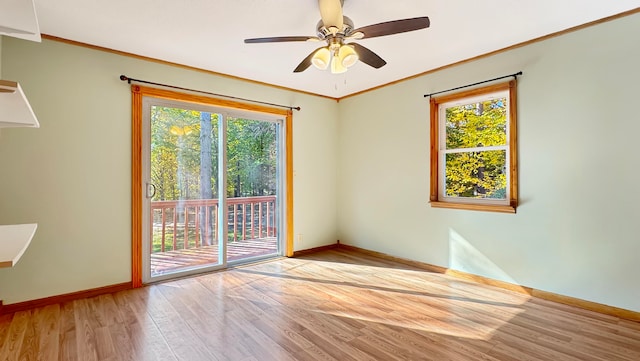 unfurnished room with light hardwood / wood-style floors, crown molding, and ceiling fan