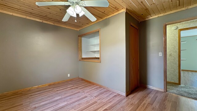 unfurnished room featuring ornamental molding, wooden ceiling, light wood-type flooring, and ceiling fan