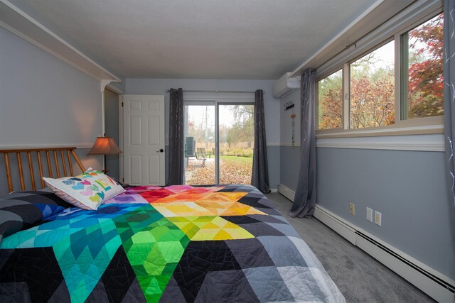 bedroom with multiple windows, a baseboard radiator, access to exterior, and carpet floors