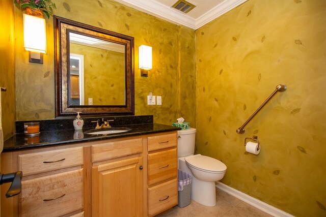 bathroom featuring vanity, ornamental molding, toilet, and tile patterned flooring