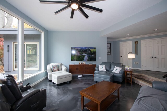 living room featuring crown molding and ceiling fan