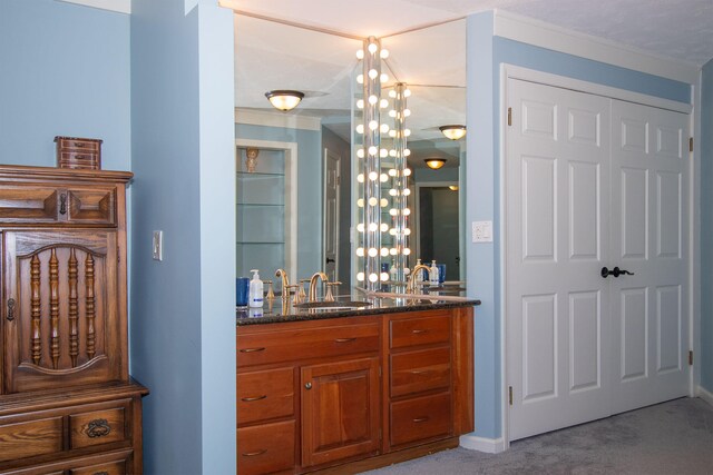 bathroom featuring vanity and crown molding