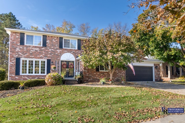 view of front facade featuring a front yard and a garage