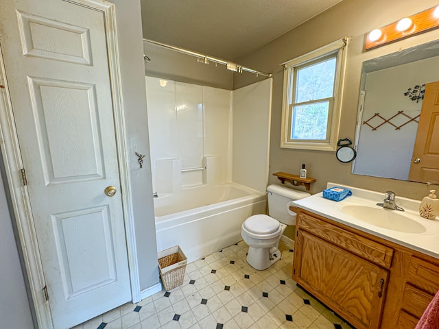 full bathroom featuring bathtub / shower combination, vanity, and toilet