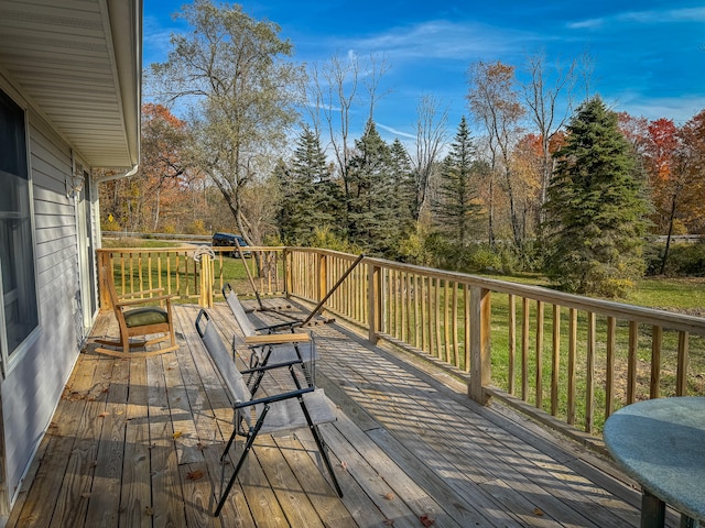 deck featuring a lawn