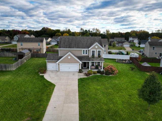 view of front of house with a front yard and a garage