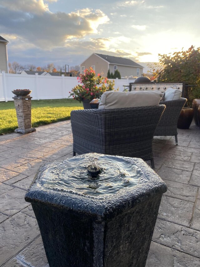 patio terrace at dusk with a lawn