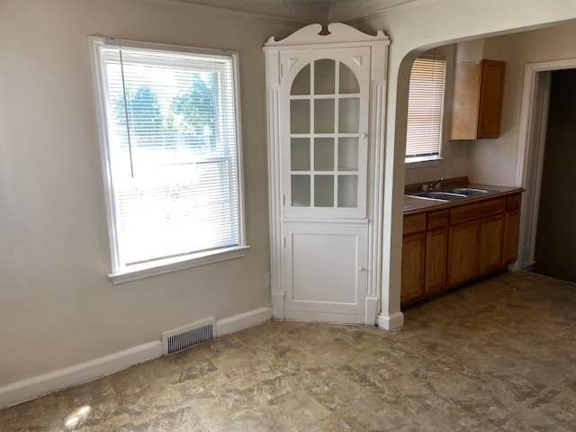 unfurnished dining area with sink