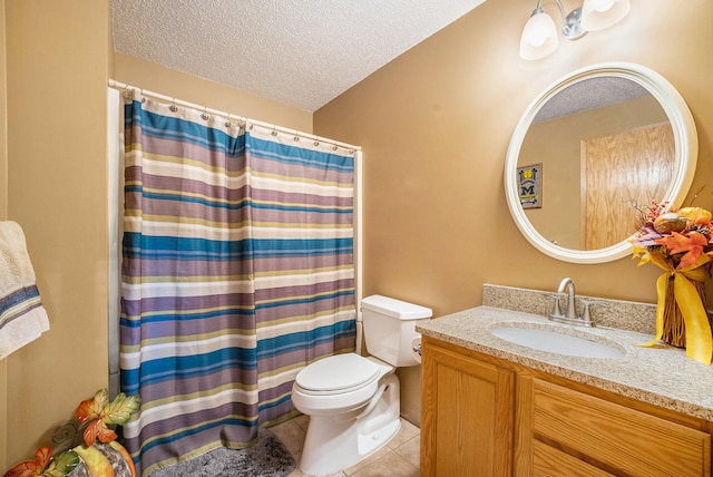 bathroom with vanity, a textured ceiling, toilet, and tile patterned flooring