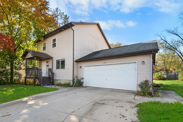 view of front property with a front lawn and a garage