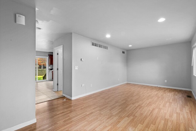 spare room with light wood-type flooring