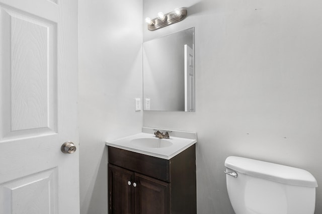 bathroom with toilet and vanity