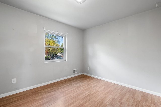 spare room featuring light hardwood / wood-style floors